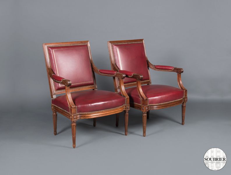Red leather armchairs old