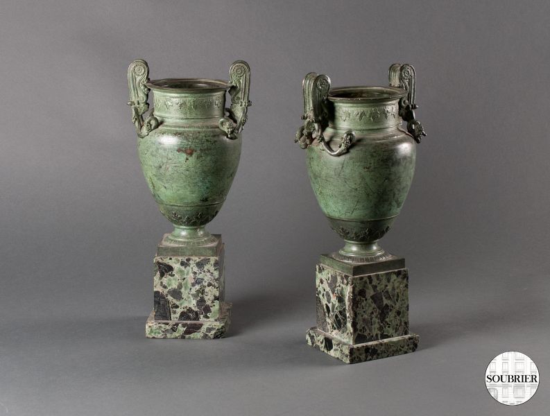 Two bronze urns