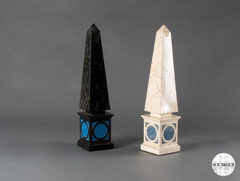 Pair of black and white obelisks