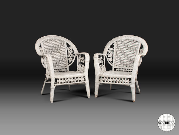 Pair of white wicker chairs