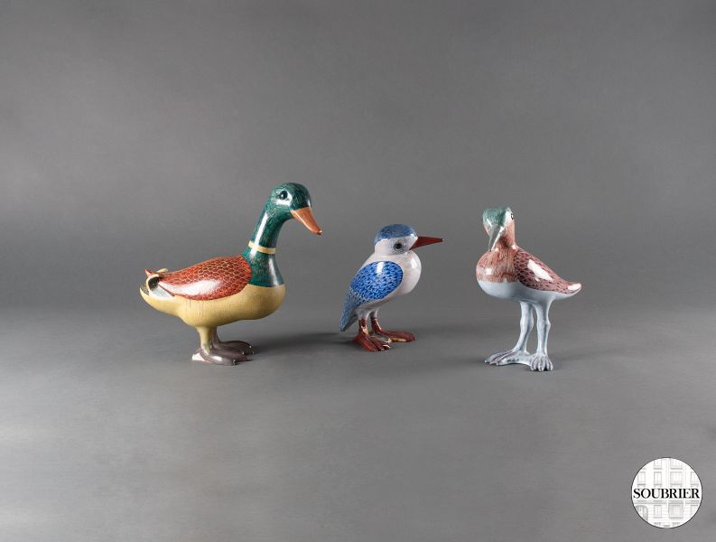 Three terracotta birds