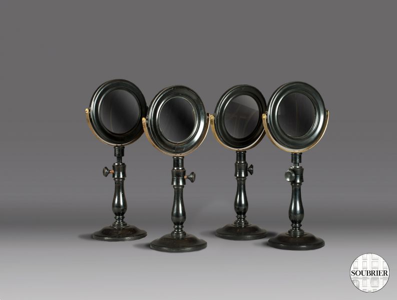 4 black round pedestal mirrors