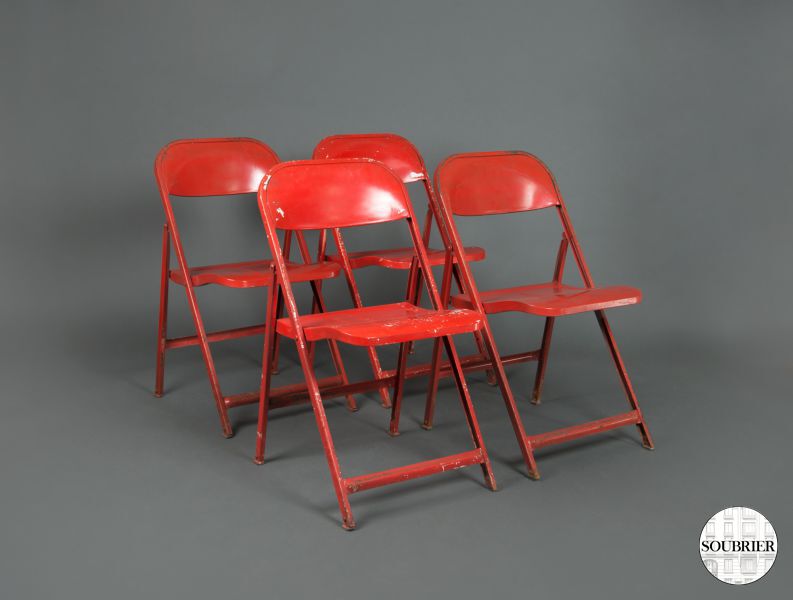 4 red folfing chairs