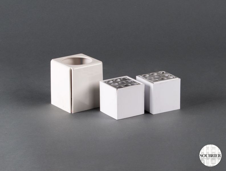 White plastic pencil holders