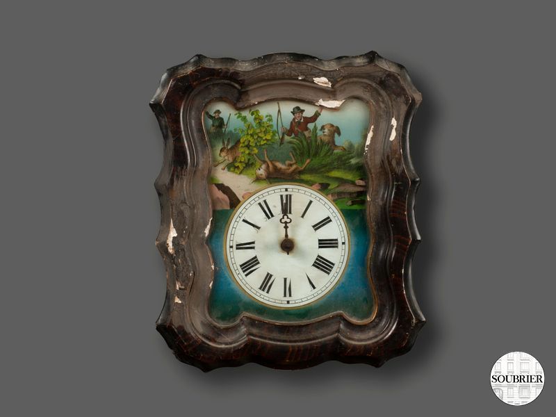 Wall clock with black frame and glass dial