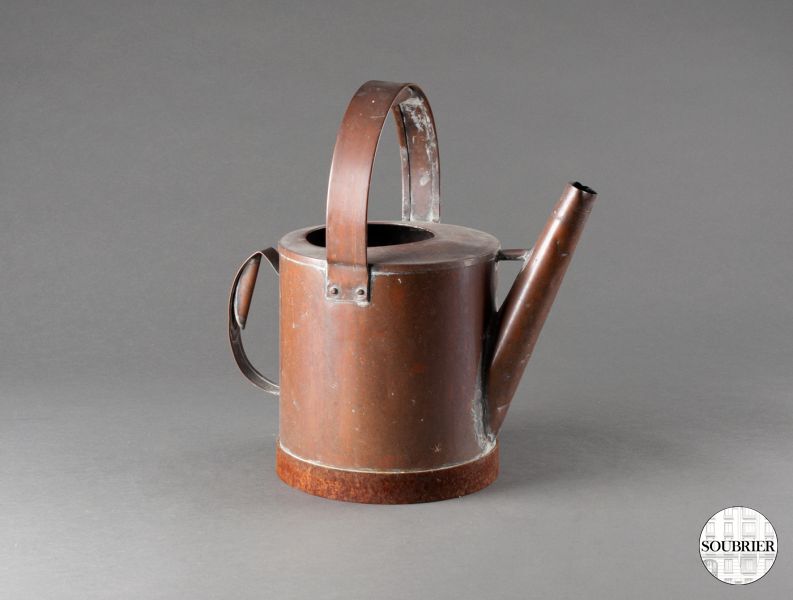 Old copper watering can