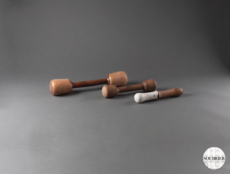 Three mortar pestles