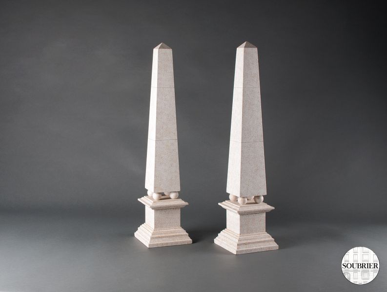 Pair of white stone obelisks