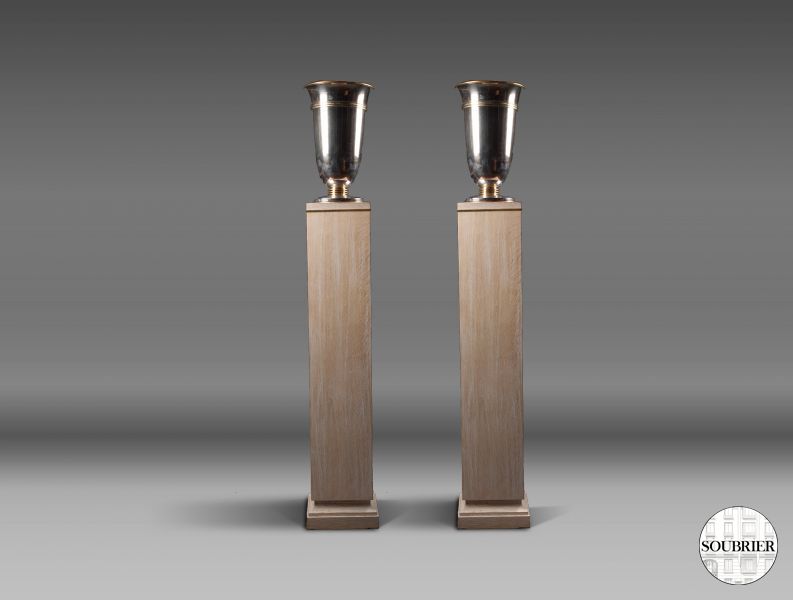 Pair of oak steles with silvered urn