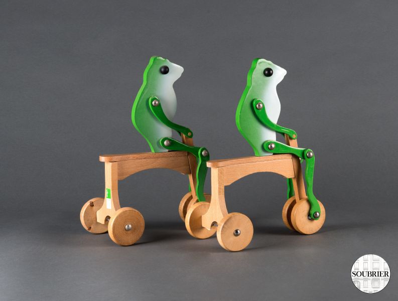 Wooden frogs by bicycle