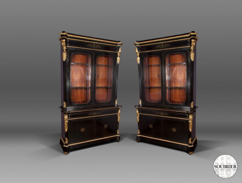 Two black & bronze bookcases