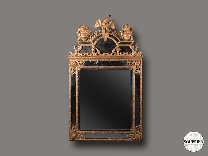 Miroir régence en bois sculpté et doré