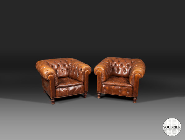 red leather Chesterfield armchairs