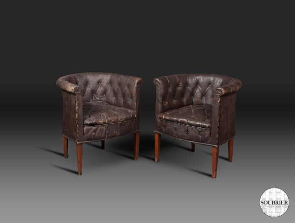 Dark brown Chesterfield armchairs